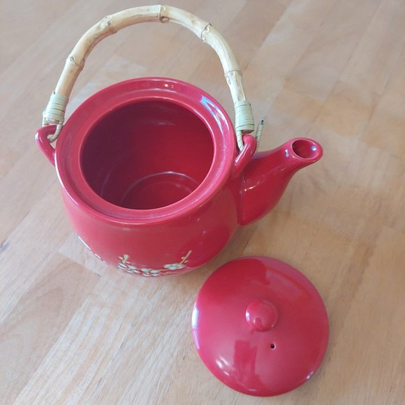 Red teapot with cherry blossom design in white with tan accent bamboo handle - Picture 7 of 12